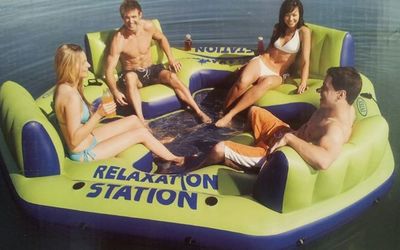 green island lounger, floating on the lake or river, cupholders ad pillow rests