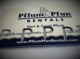 Pflum Pfun Rentals water rental punch card! Pflum Pfun Rentals business card with 5 P-shaped hole punches in it. Rent 5 water items and get the 6th day free, just in time for summer!